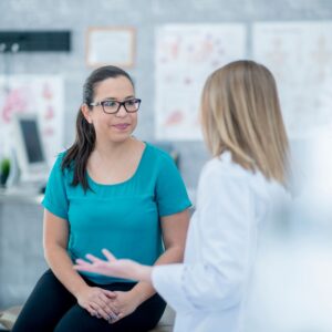 A woman speaking with her doctor