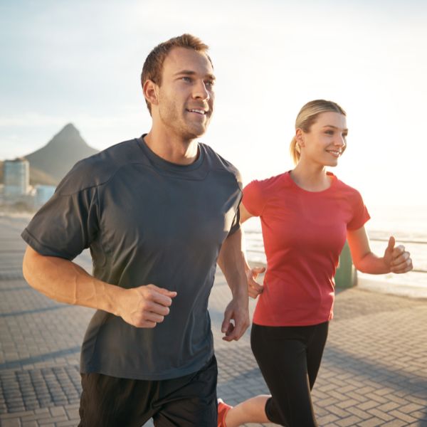 healthy couple running together