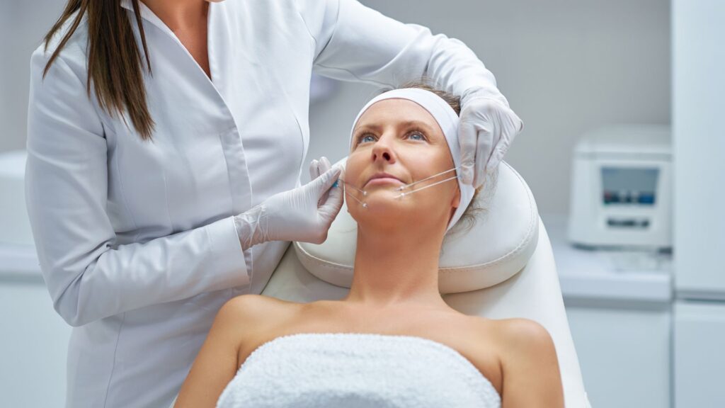 Woman preparing to get thread lifting by a trained professional.